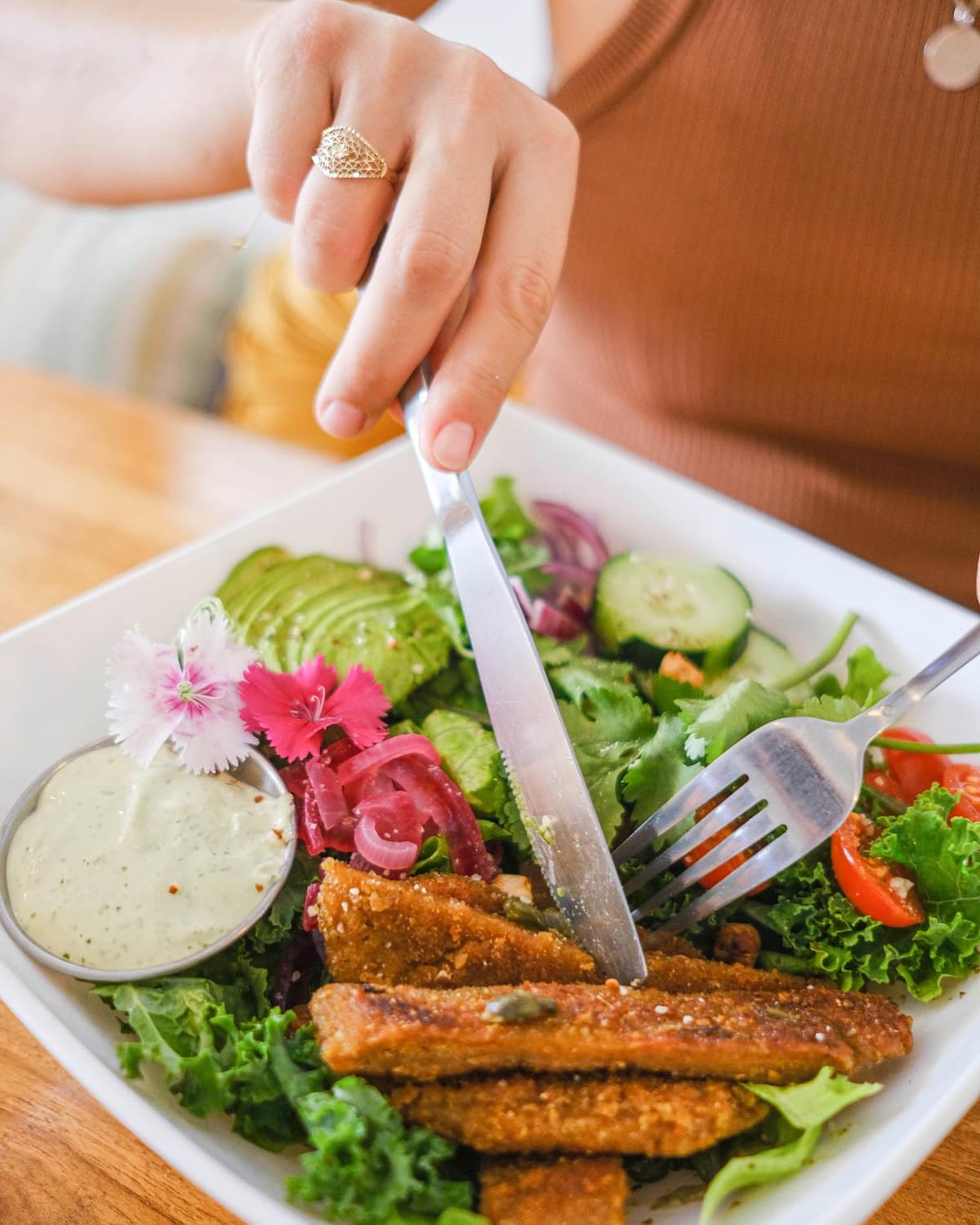 Karma plant-based salad bowl with avocado, lentils, and cilantro dressing